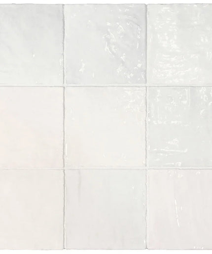 White ceramic tiles with subtle texture on a white background