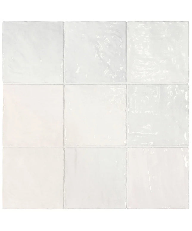 White ceramic tiles with subtle texture on a white background