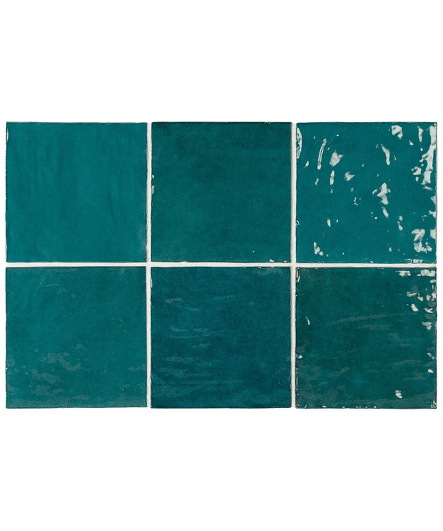 Teal tiles with visible wear and tear on a white background