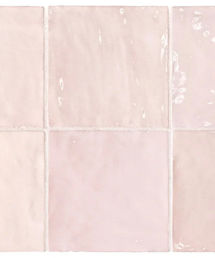 Set of six pink ceramic tiles with a subtle pattern