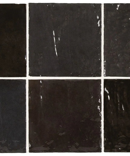 Six black square tiles with varying textures and patterns.