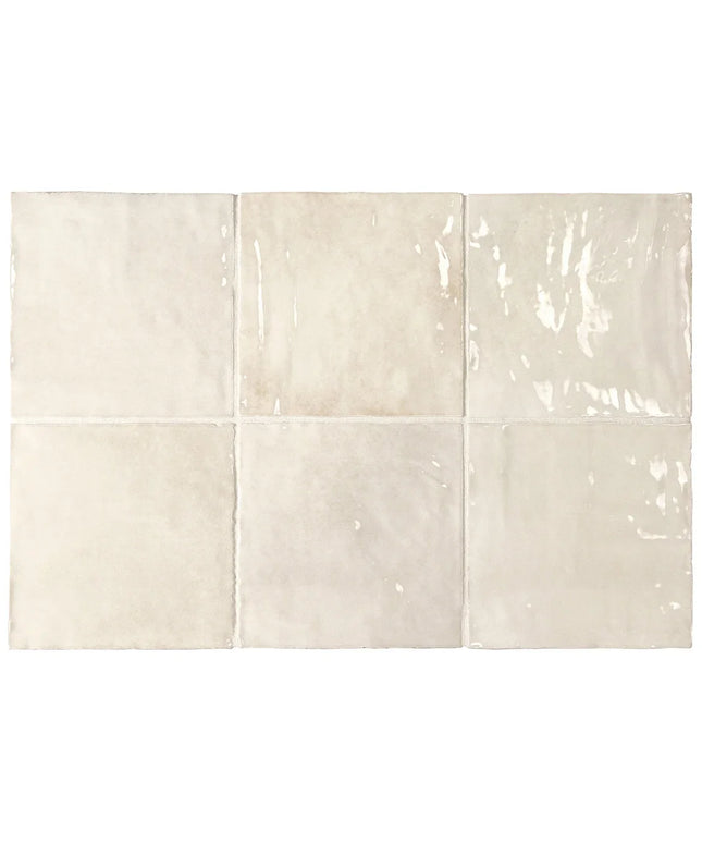 Set of six ceramic tiles in a beige color with subtle patterns