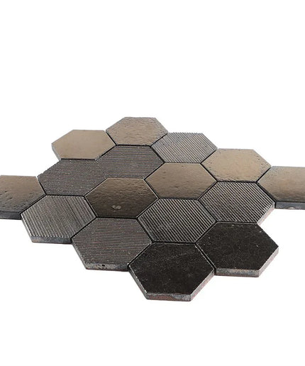 Hexagonal tiles with a metallic finish on a white background