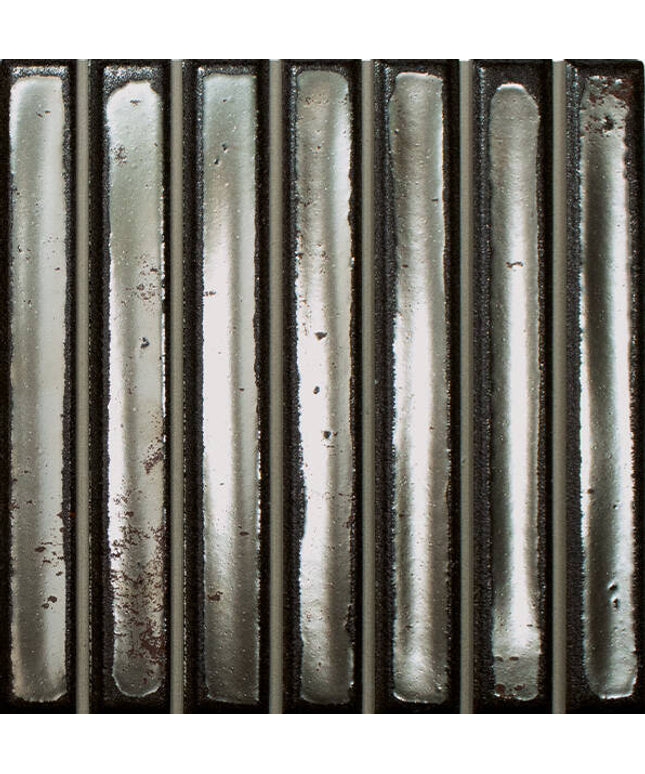 Metallic cylindrical objects with a textured surface on a black background