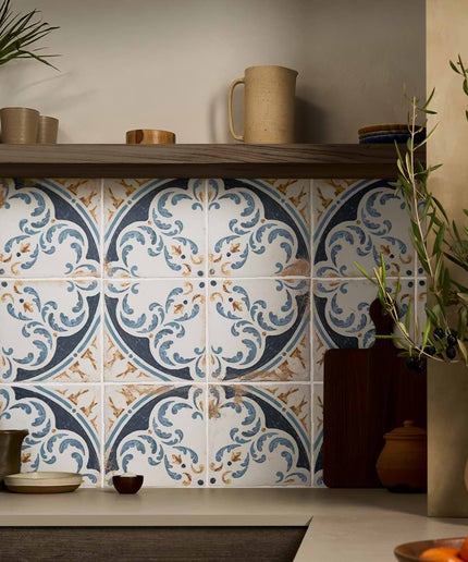 Blue and white patterned ceramic wall tiles used as a kitchen backsplash