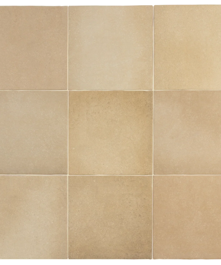 Nine square beige stone tiles arranged in a 3x3 grid, showing natural tonal variation and subtle texture.