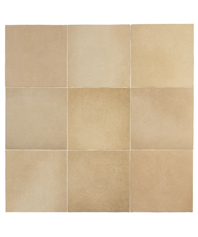 Nine square beige stone tiles arranged in a 3x3 grid, showing natural tonal variation and subtle texture.