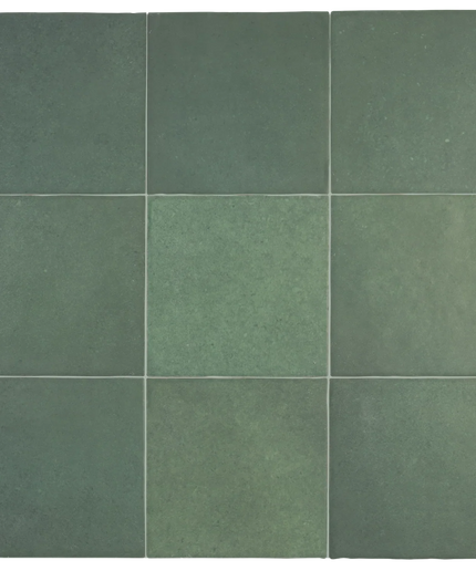 A 3x3 grid of square ceramic tiles in various shades of muted sage green, arranged in a clean pattern with thin grout lines.