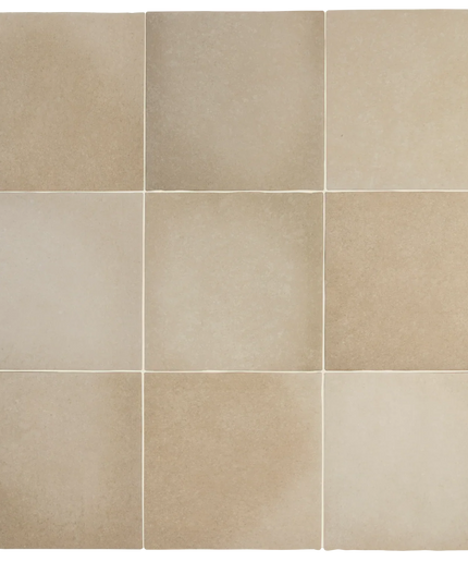 A 3x3 grid of square beige stone-look tiles with subtle natural tonal variation and light grout lines.