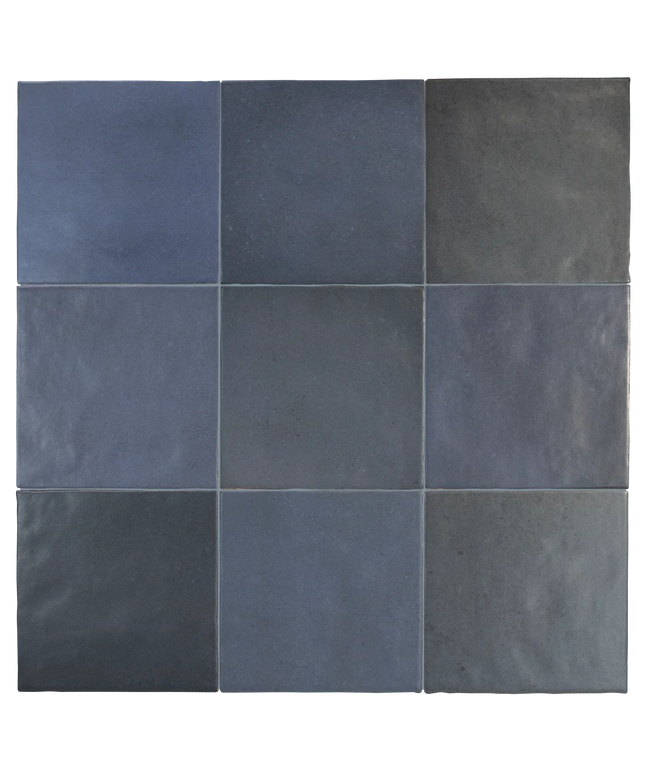 A 3x3 grid of square ceramic tiles in various shades of slate blue, navy, and charcoal gray, arranged in a clean pattern with thin grout lines.