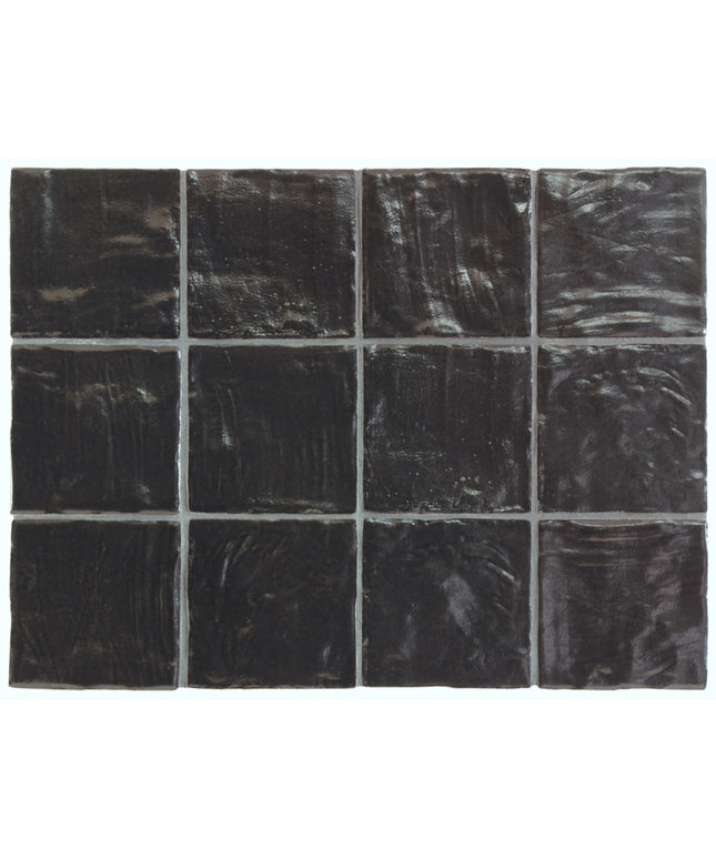 Black square tiles with a glossy finish on a white background