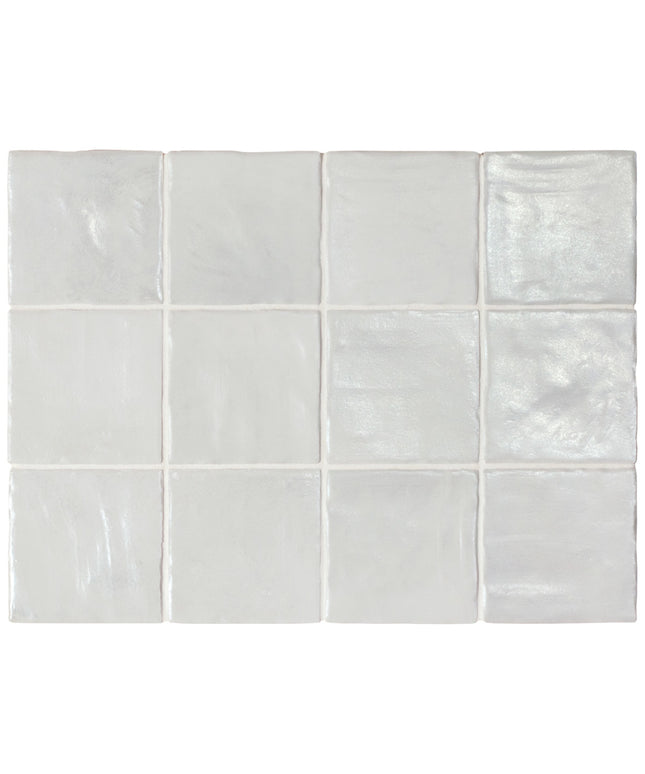 White ceramic tiles with a subtle pattern on a white background