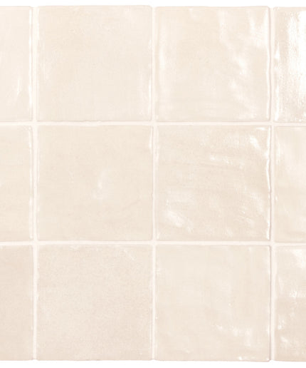 Beige ceramic tiles arranged in a grid pattern on a white background