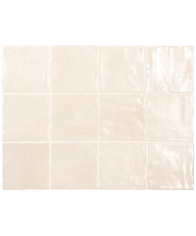 Beige ceramic tiles arranged in a grid pattern on a white background