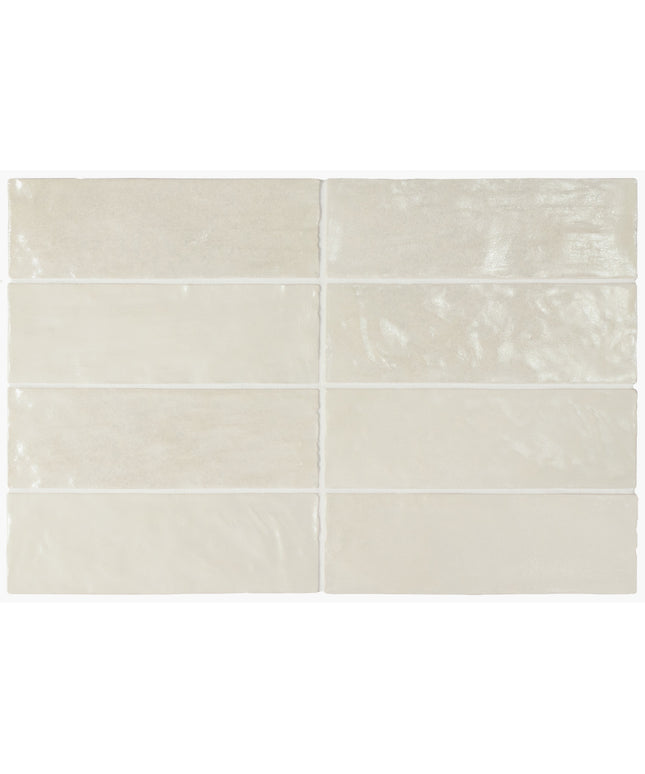 Set of six beige ceramic tiles with subtle patterns on a white background