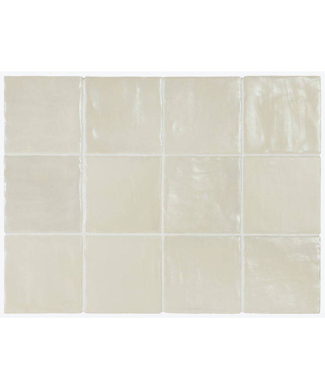 Beige ceramic tiles arranged in a grid pattern on a white background