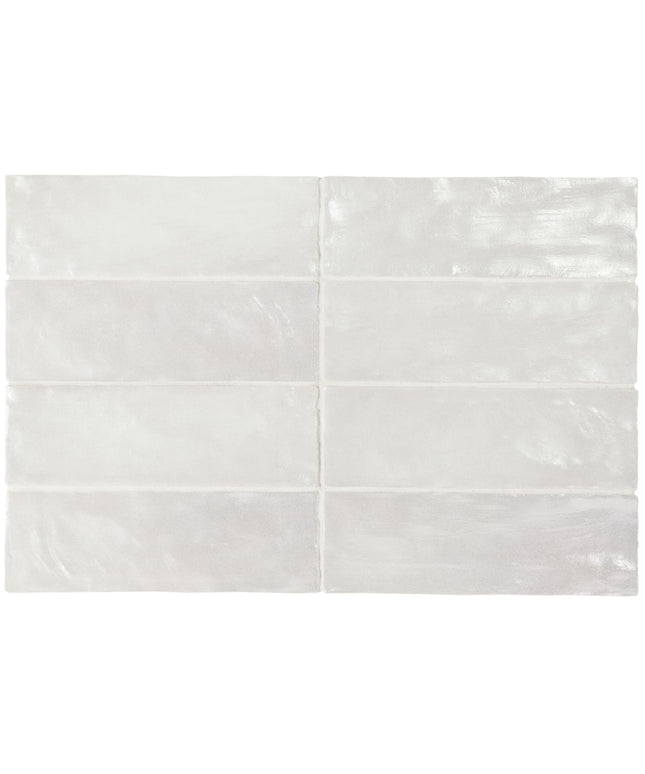 Set of four white ceramic tiles with a subtle pattern on a white background