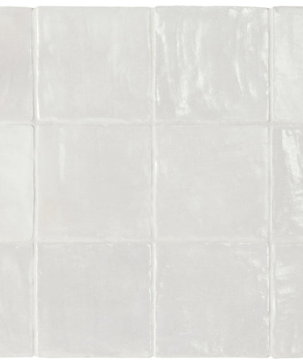 White ceramic tiles arranged in a grid pattern on a white background