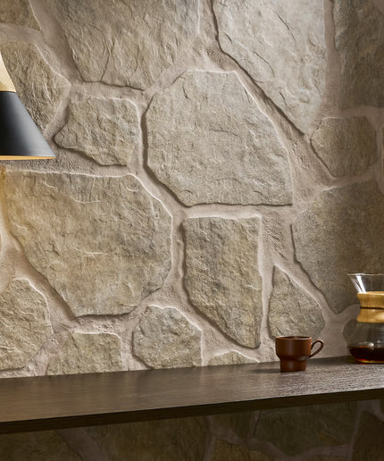 Stone wall with a coffee cup and Chemex on a wooden surface
