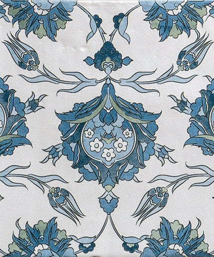 Blue and white decorative tile with symmetrical floral pattern