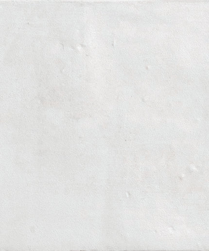 White ceramic tile with subtle textured surface, ideal for bathrooms or kitchen backsplashes