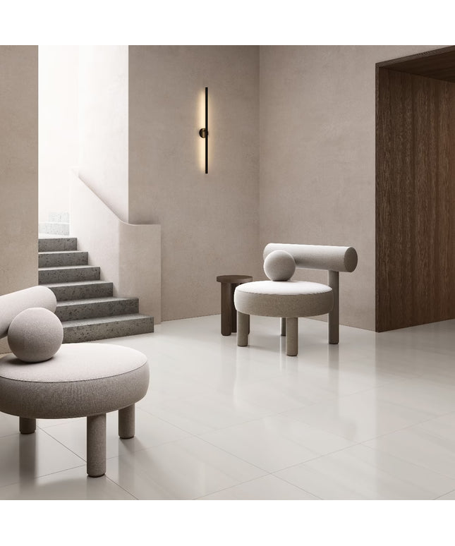 Modern interior with gray chairs and a staircase in a minimalistic setting