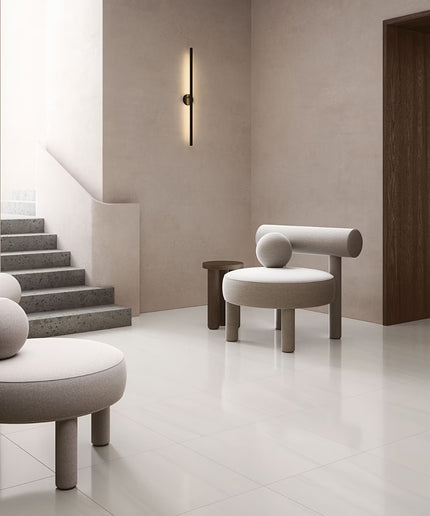 Modern interior with gray chairs and a staircase in a minimalistic setting