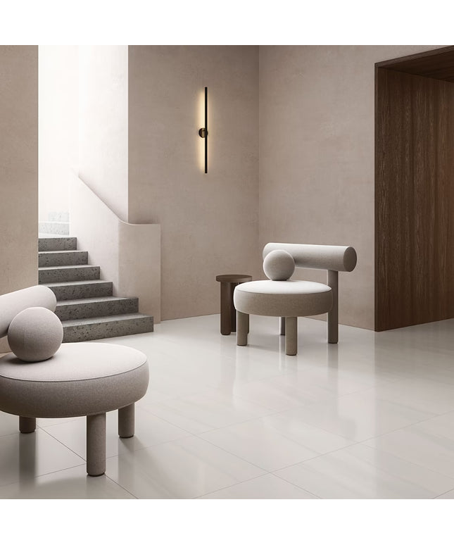 Modern interior with gray chairs and a staircase in a minimalistic setting