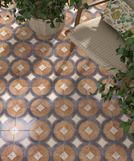 Patterned tile floor with a chair and plants