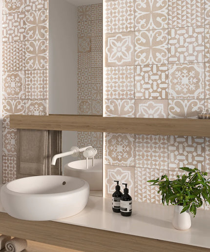 Bathroom with decorative tiles, sink, and plants