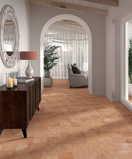 Modern interior with wooden flooring, a sideboard, and a lamp.