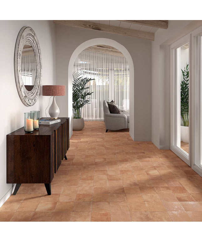 Modern interior with wooden flooring, a sideboard, and a lamp.