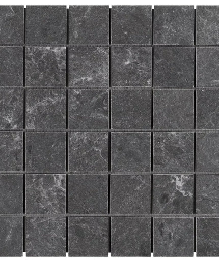 Mosaic pattern of dark gray tiles on a white background