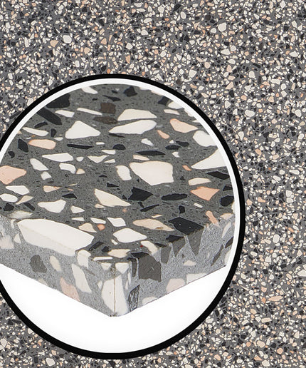 Terrazzo patterned stone with a circular inset on a similar terrazzo background