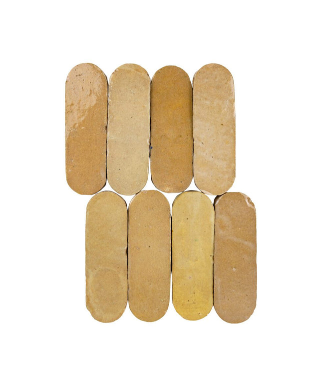 Nomad sand 2x6 oval ceramic tiles in warm beige tones for backsplash or floor