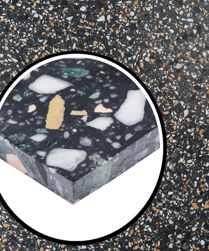 Close-up of a speckled surface with a circular inset showing a block of the material.