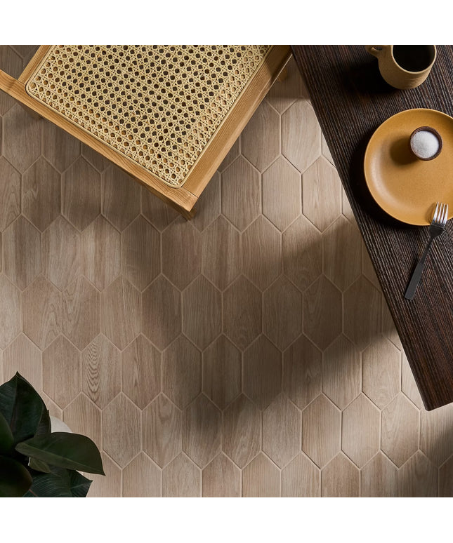 Hexagonal wooden tiles on a floor with a table and decor items.