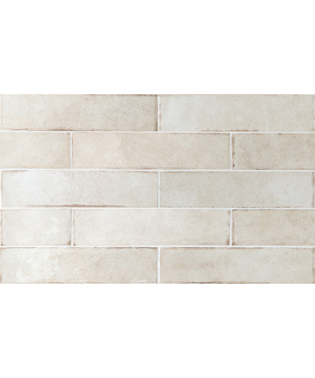 Beige tiles with a subtle pattern on a white background