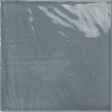 A square glossy ceramic tile in a muted slate blue-gray color, showing subtle light reflections on its glazed surface.