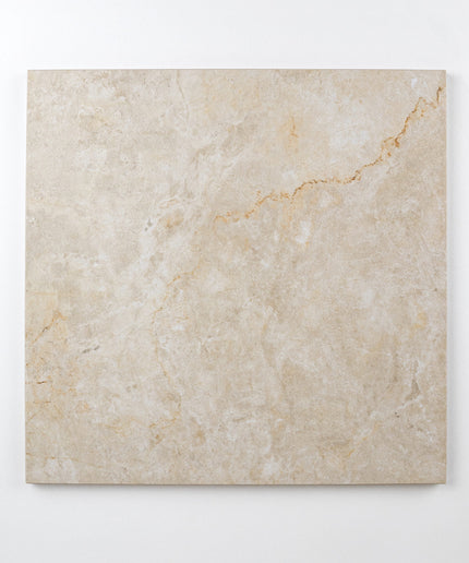 Cream-colored Parisian chequer 12x12 floor tile with subtle marble pattern