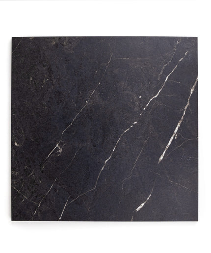 Black porcelain floor tile with subtle white veining and matte finish, 12x12 inch