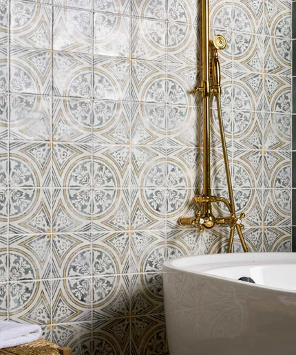 Bathroom with decorative tiles and a white bathtub