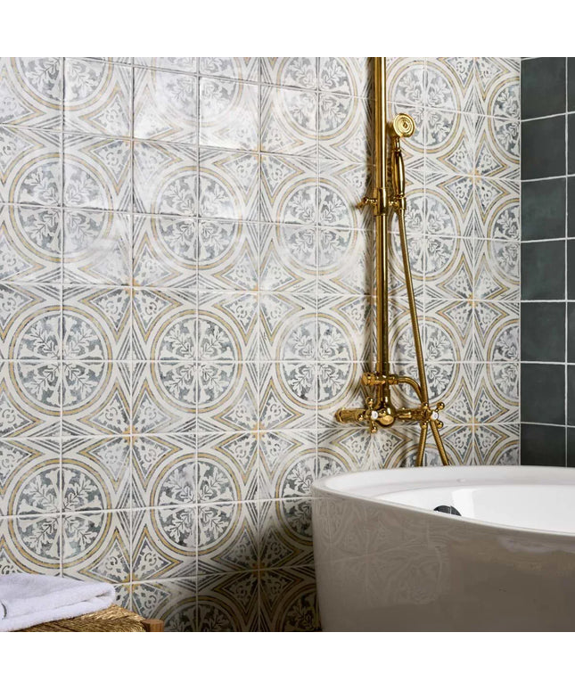 Bathroom with decorative tiles and a white bathtub