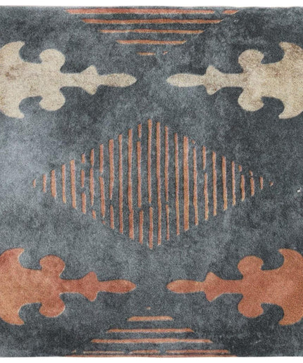 Decorative rug with geometric pattern on a dark background