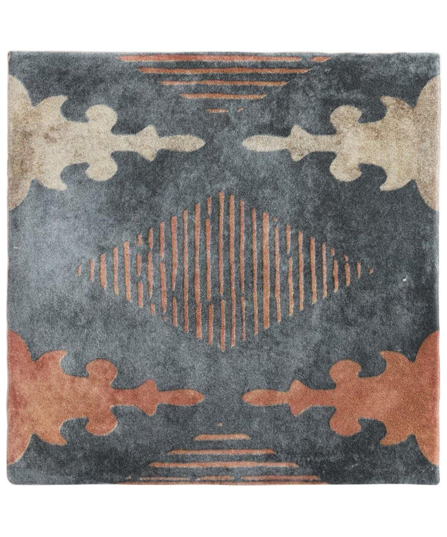 Decorative rug with geometric pattern on a dark background