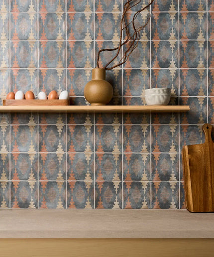 Kitchen counter with patterned tiles and wooden items