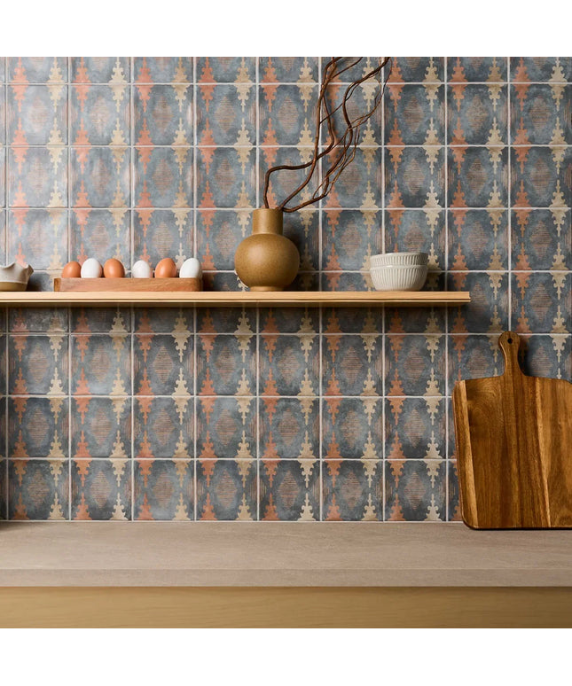 Kitchen counter with patterned tiles and wooden items