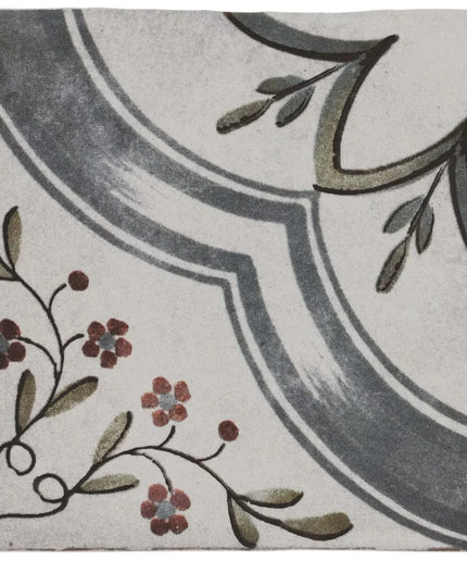 Decorative tile with floral and leaf patterns on a white background