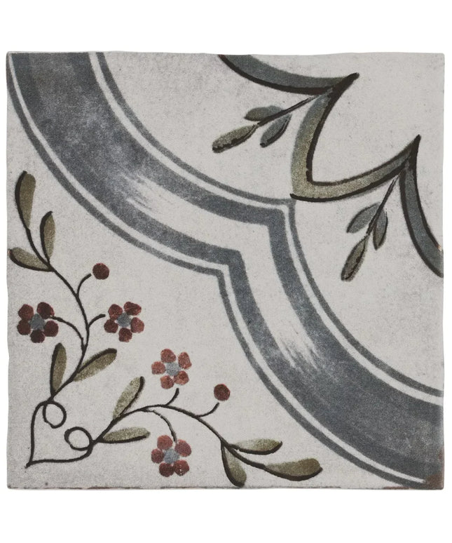 Decorative tile with floral and leaf patterns on a white background