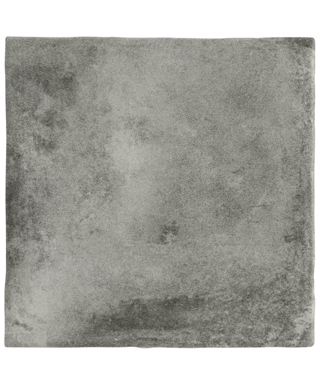 Square tile with a textured gray surface